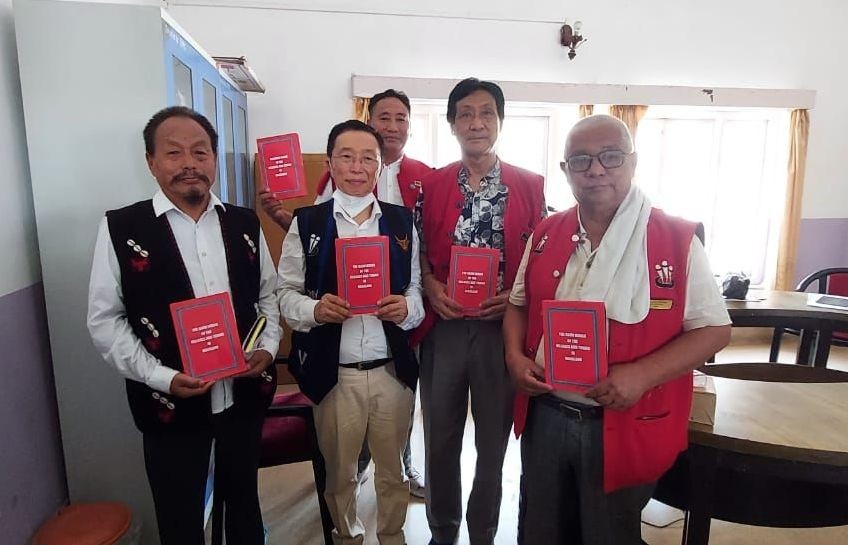 Former bureaucrat, K Nzimongo Ngullie (Left) and MLA, Dr Sukhato A Sema (Second from left) with NGBF members at the book launch at the Circuit House, Dimapur on September 7. (Morung Photo)